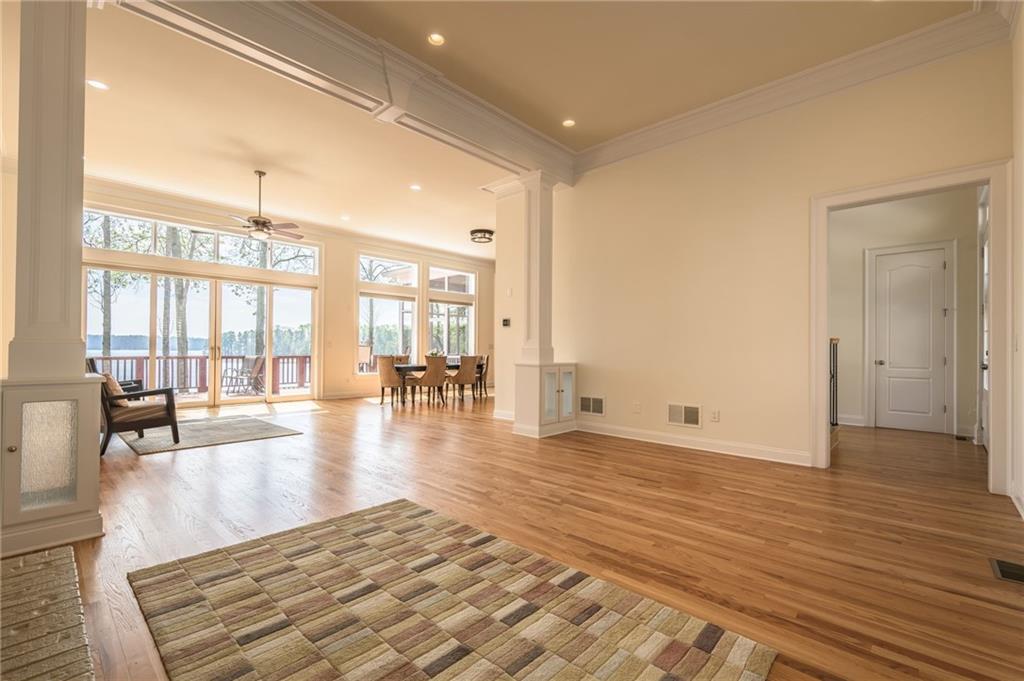 9510 Lisa Circle Gainesville, GA 30506 - Photo 22 of 80 an empty room with wooden floor and windows