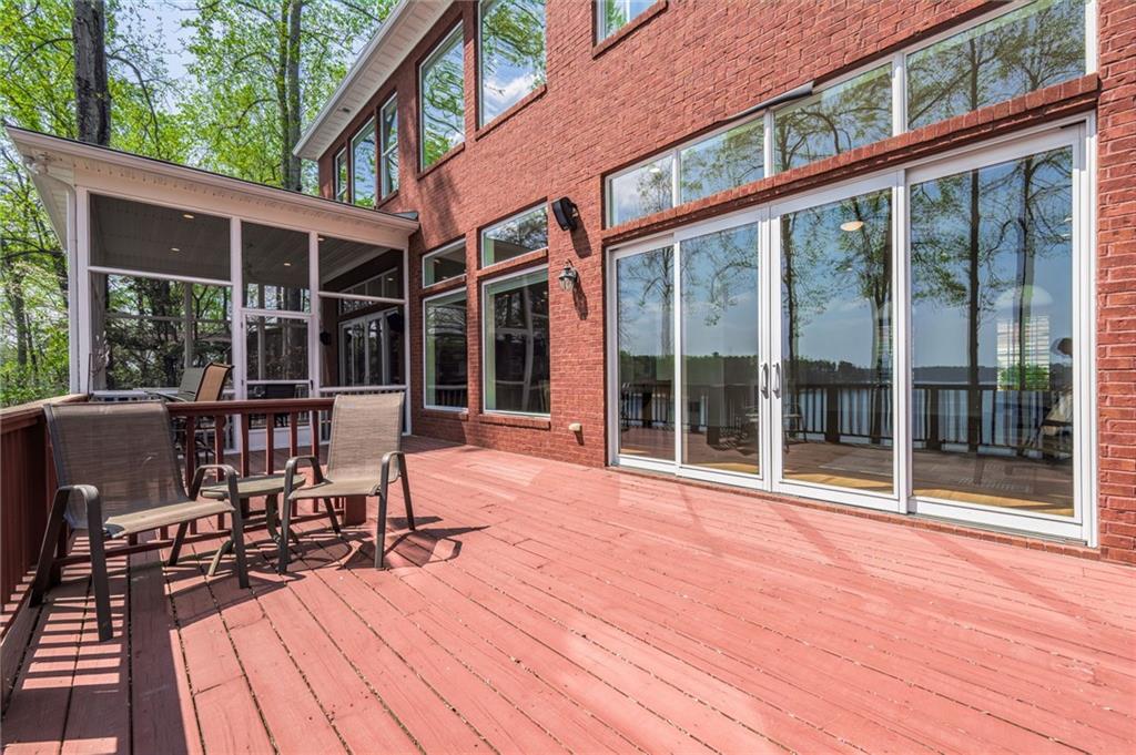 9510 Lisa Circle Gainesville, GA 30506 - Photo 39 of 80 a view of a patio with table and chairs and wooden floor