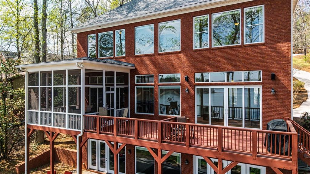 9510 Lisa Circle Gainesville, GA 30506 - Photo 4 of 80 a view of a brick house with large windows