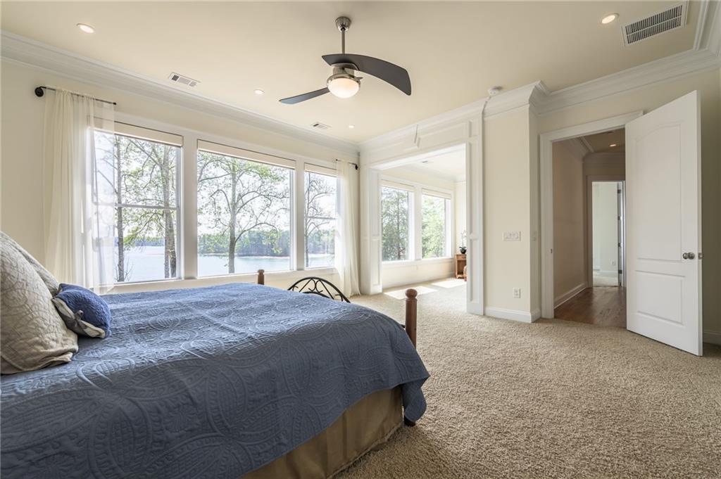 9510 Lisa Circle Gainesville, GA 30506 - Photo 44 of 80 a spacious bedroom with a bed and a large window