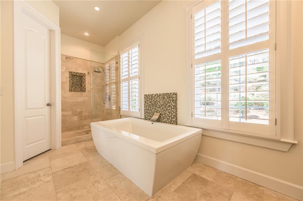 9510 Lisa Circle Gainesville, GA 30506 - Photo 52 of 80 a spacious bathroom with a bathtub and shower
