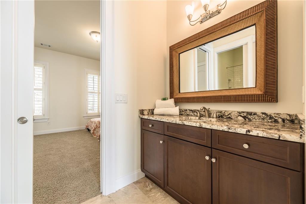 9510 Lisa Circle Gainesville, GA 30506 - Photo 58 of 80 a bathroom with a sink and a mirror