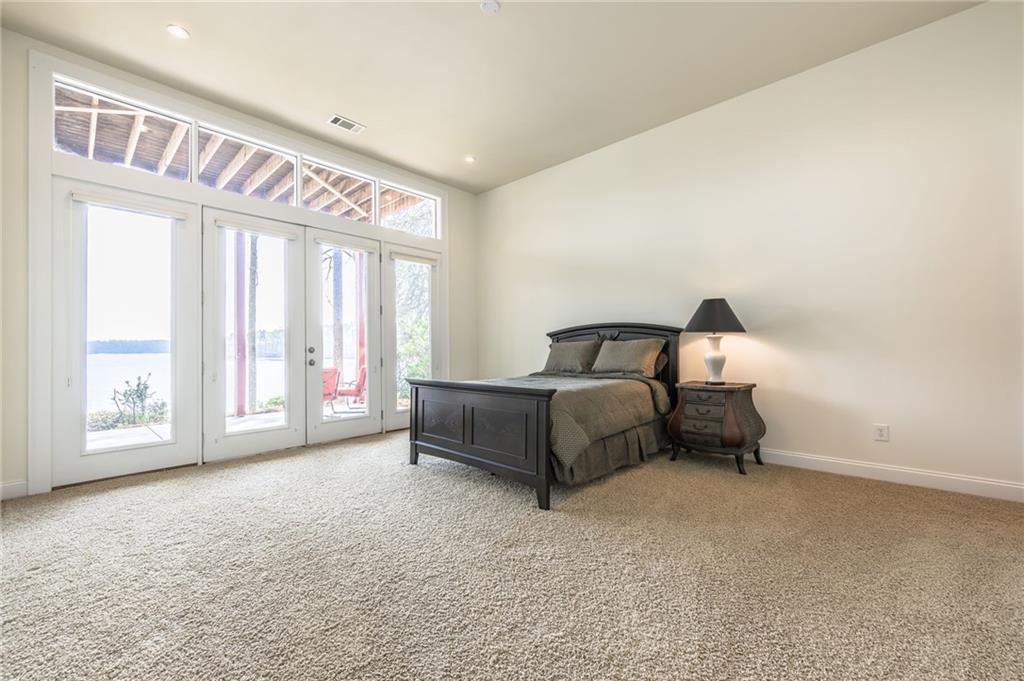 9510 Lisa Circle Gainesville, GA 30506 - Photo 67 of 80 a bedroom with a bed and a large window