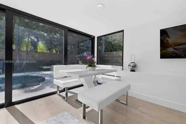 a living room with couches a coffee table and a flat screen tv