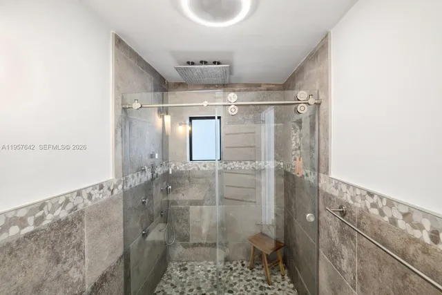 a table and chairs in front of a yard