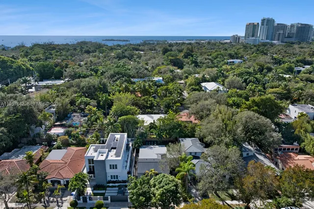 an aerial view of a house with a lake view