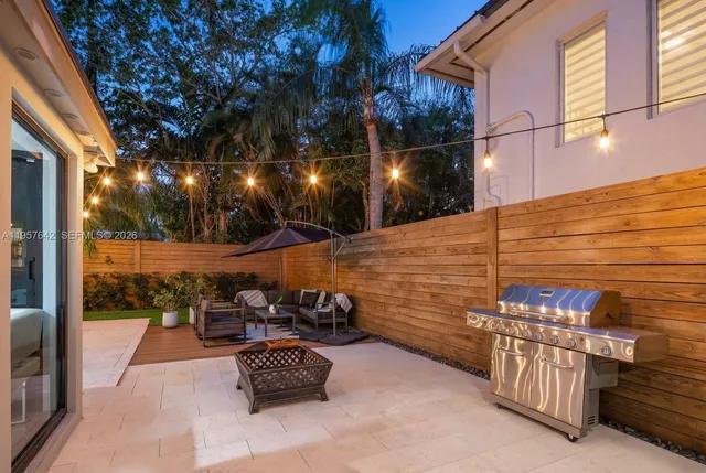 a view of a chairs and table in the balcony