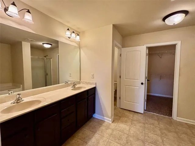 a bathroom with a double vanity sink mirror and double