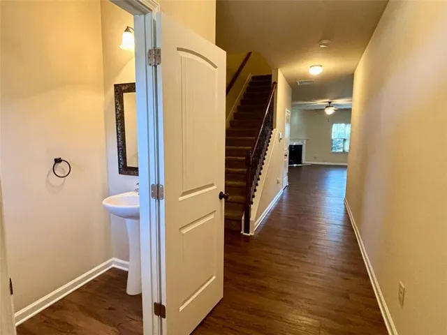 a view of hallway with wooden floor