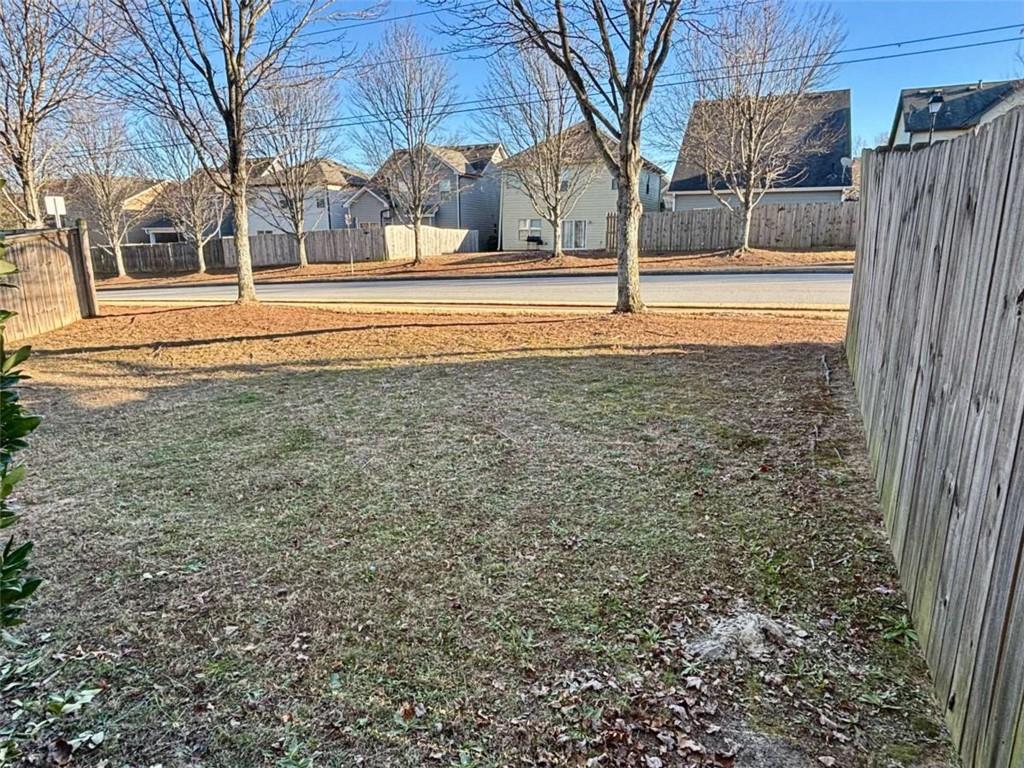 2723 Morgan Glen Road Northeast Buford, GA 30519 - Photo 24 of 25 a view of a yard with a house