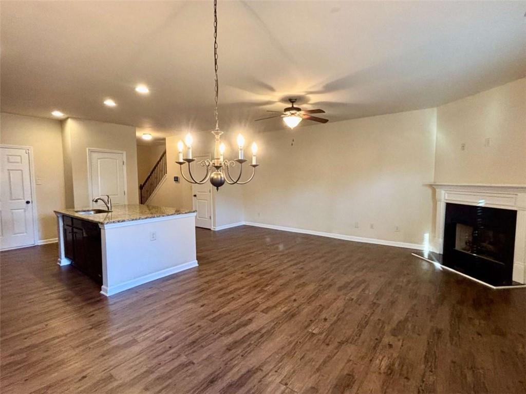 2723 Morgan Glen Road Northeast Buford, GA 30519 - Photo 5 of 25 a view of a room with wooden floor and kitchen view
