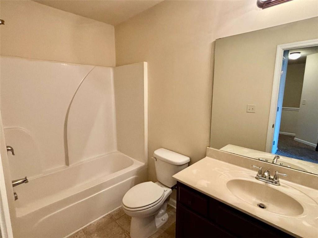 2723 Morgan Glen Road Northeast Buford, GA 30519 - Photo 10 of 25 a bathroom with a sink toilet and shower