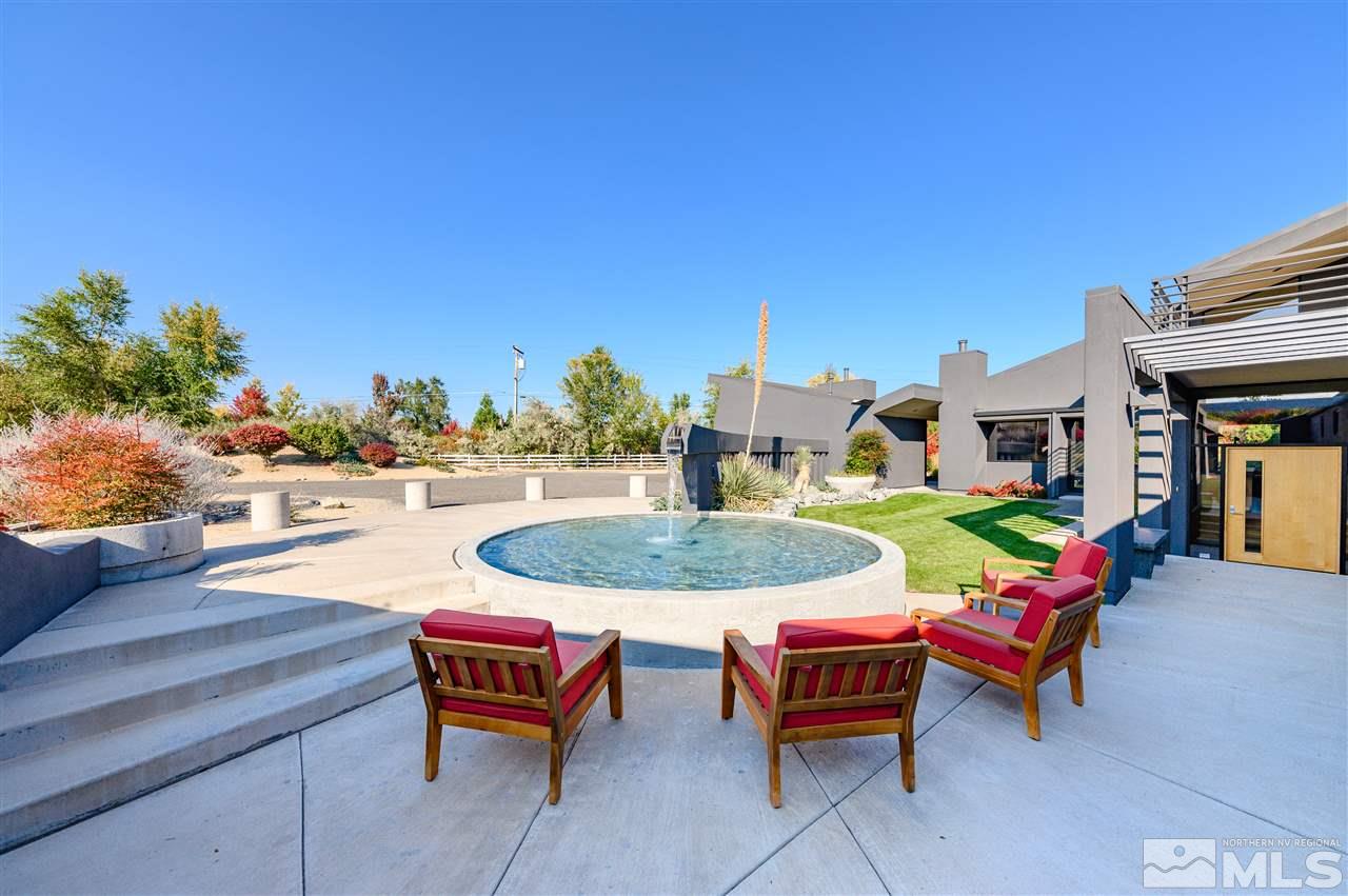 350 Juniper Hill Road Reno, NV 89519 - Photo 3 of 24 a outdoor space with furniture and a fireplace