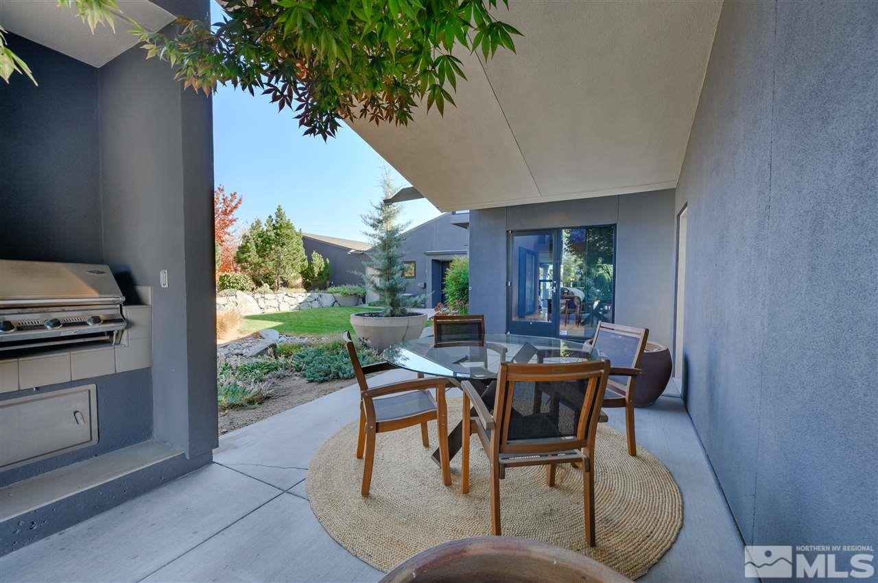 350 Juniper Hill Road Reno, NV 89519 - Photo 7 of 24 a patio with table and chairs and potted plants