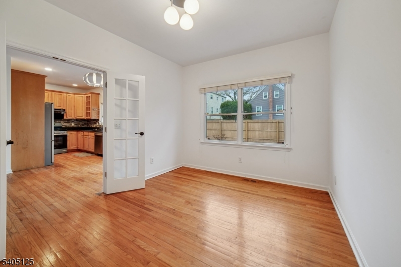 17 Grove Street Summit, NJ 07901 - Photo 15 of 42 a view of an empty room with window and wooden floor
