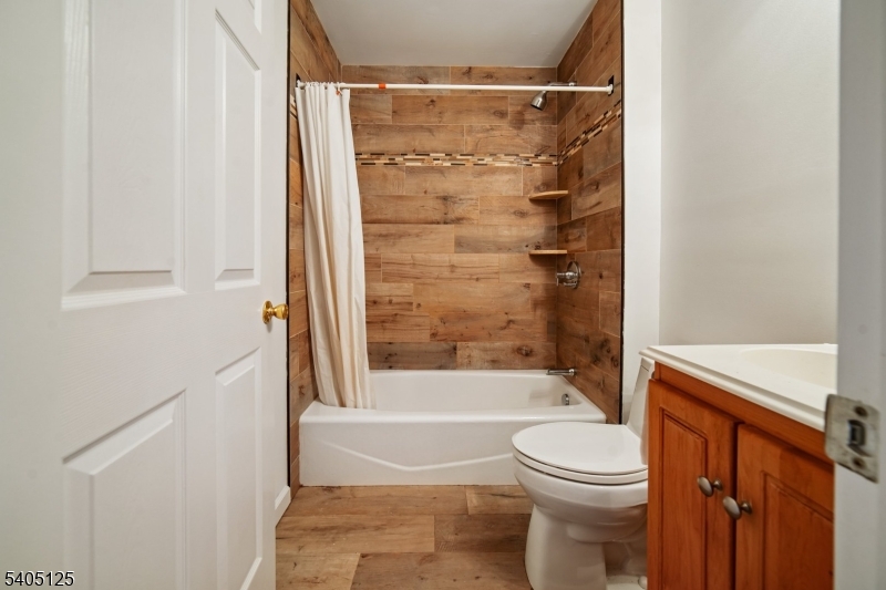 17 Grove Street Summit, NJ 07901 - Photo 31 of 42 a bathroom with a toilet and a bathtub