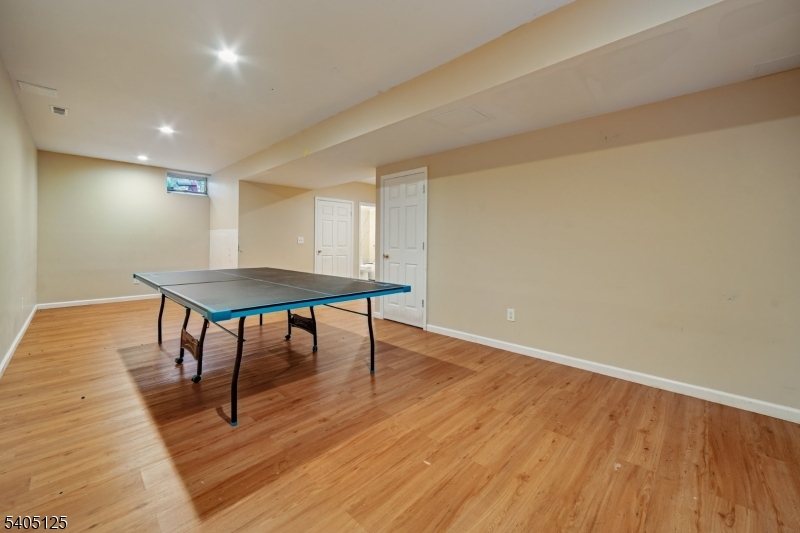 17 Grove Street Summit, NJ 07901 - Photo 40 of 42 a room with wooden floor and table