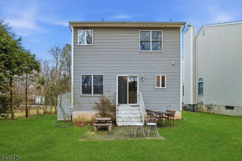 17 Grove Street Summit, NJ 07901 - Photo 42 of 42 a backyard of a house with table and chairs
