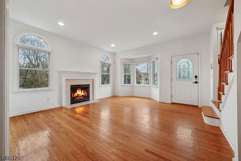 17 Grove Street Summit, NJ 07901 - Photo 5 of 42 a view of an empty room with a window and fireplace