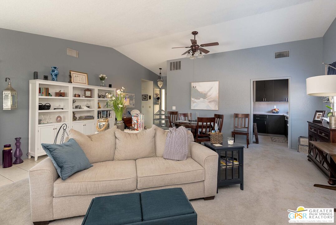 9760 Capiland Road Desert Hot Springs, CA 92240 - Photo 3 of 16 a living room with furniture and a flat screen tv