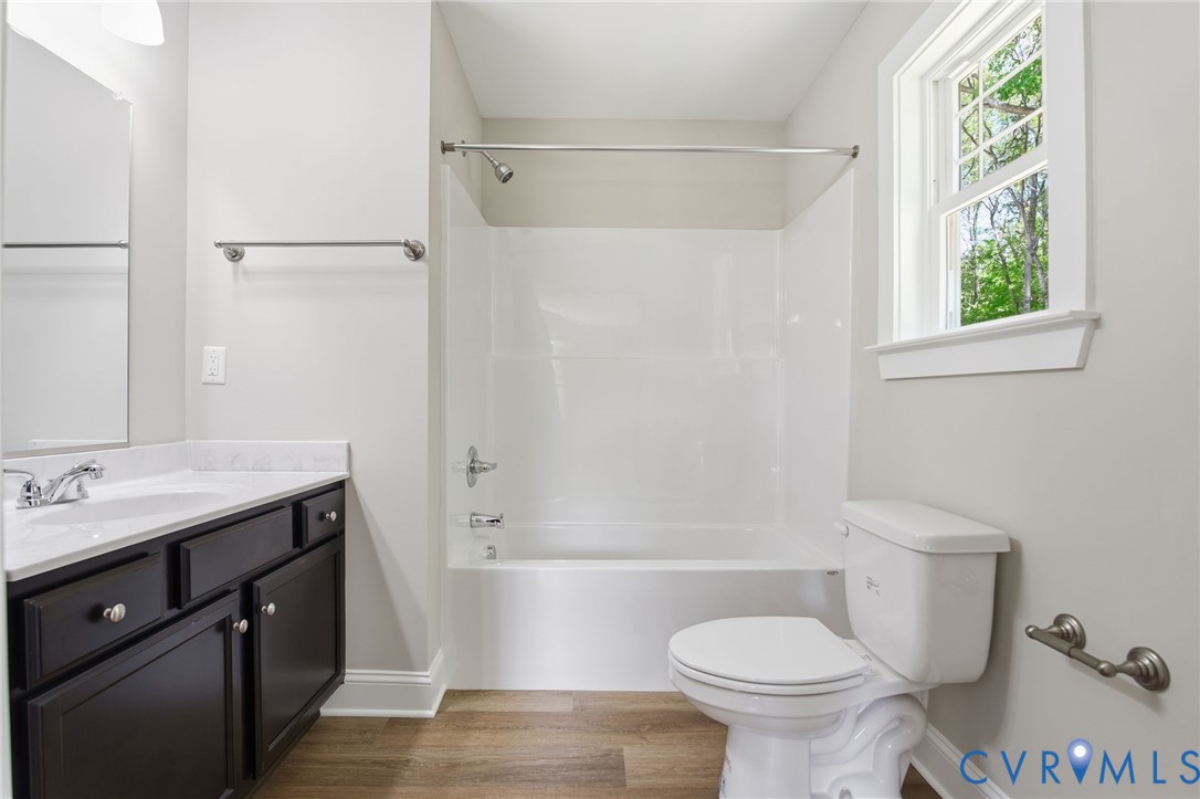 17557 Hewlett Road Beaverdam, VA 23015 - Photo 24 of 29 a bathroom with a sink toilet and shower