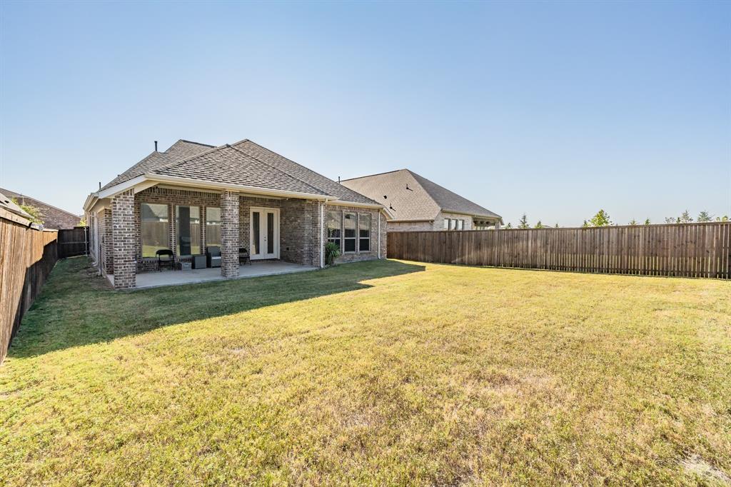 795 Knoxbridge Road Forney, TX 75126 - Photo 15 of 17 a front view of a house with a yard