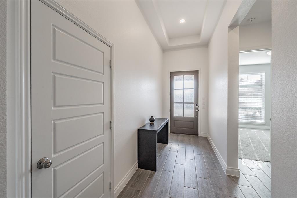 795 Knoxbridge Road Forney, TX 75126 - Photo 4 of 17 a view of hallway with wooden floor