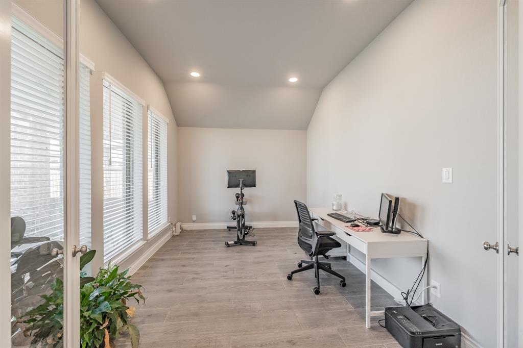 795 Knoxbridge Road Forney, TX 75126 - Photo 8 of 17 a view of a workspace with furniture and a window