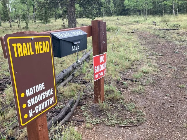 swimming pool view with a seating space