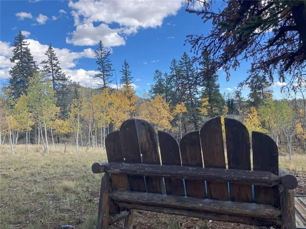 a view of a wooden house with a yard