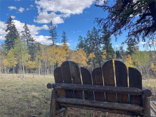 a view of a wooden house with a yard