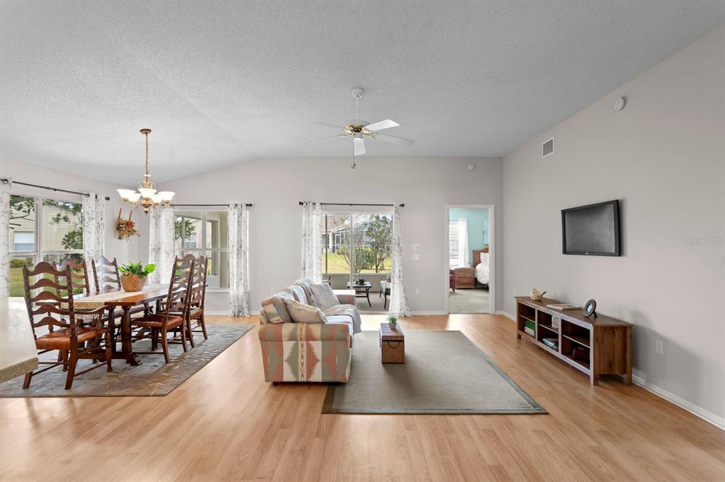 11751 Aintree Court Trinity, FL 34655 - Photo 13 of 45 a living room with furniture or chandelier and a wooden floor