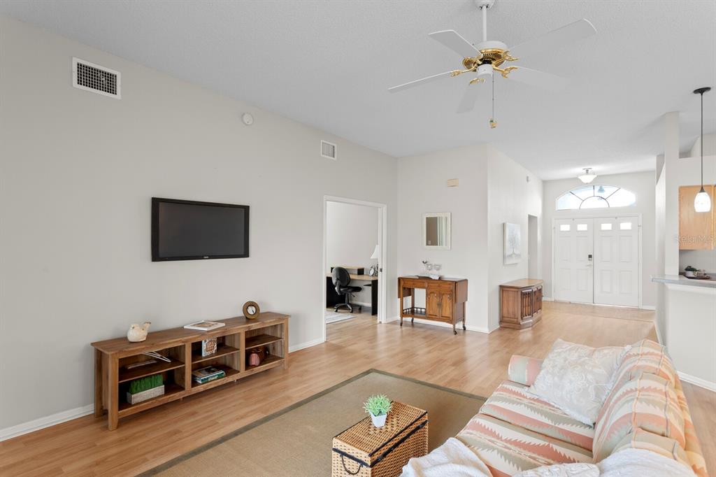 11751 Aintree Court Trinity, FL 34655 - Photo 18 of 45 a living room with furniture and wooden floor