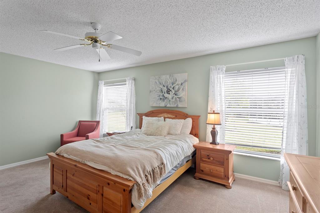11751 Aintree Court Trinity, FL 34655 - Photo 20 of 45 a bedroom with a bed and window