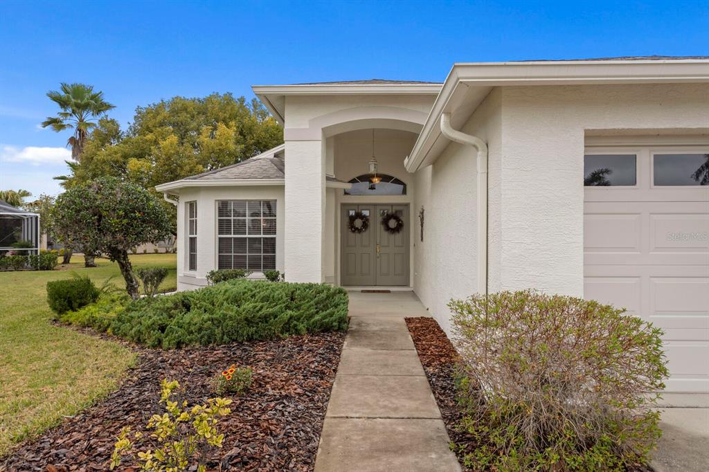 11751 Aintree Court Trinity, FL 34655 - Photo 2 of 45 a front view of a house with a yard