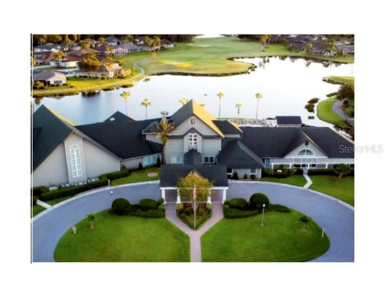 11751 Aintree Court Trinity, FL 34655 - Photo 39 of 45 a aerial view of a house with a garden and lake view