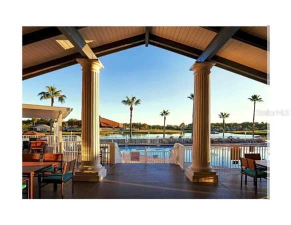 a kitchen view with table and chairs