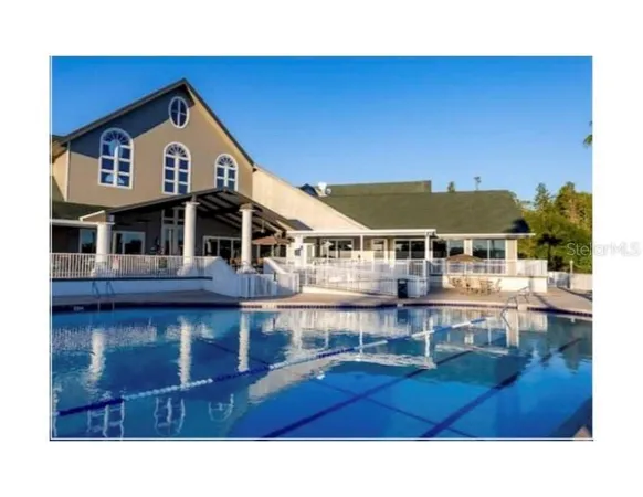 a room with lots of tables and chairs