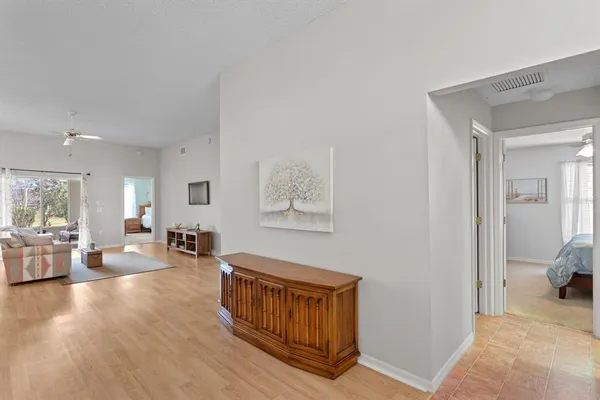 a view of a livingroom with furniture and hardwood floor