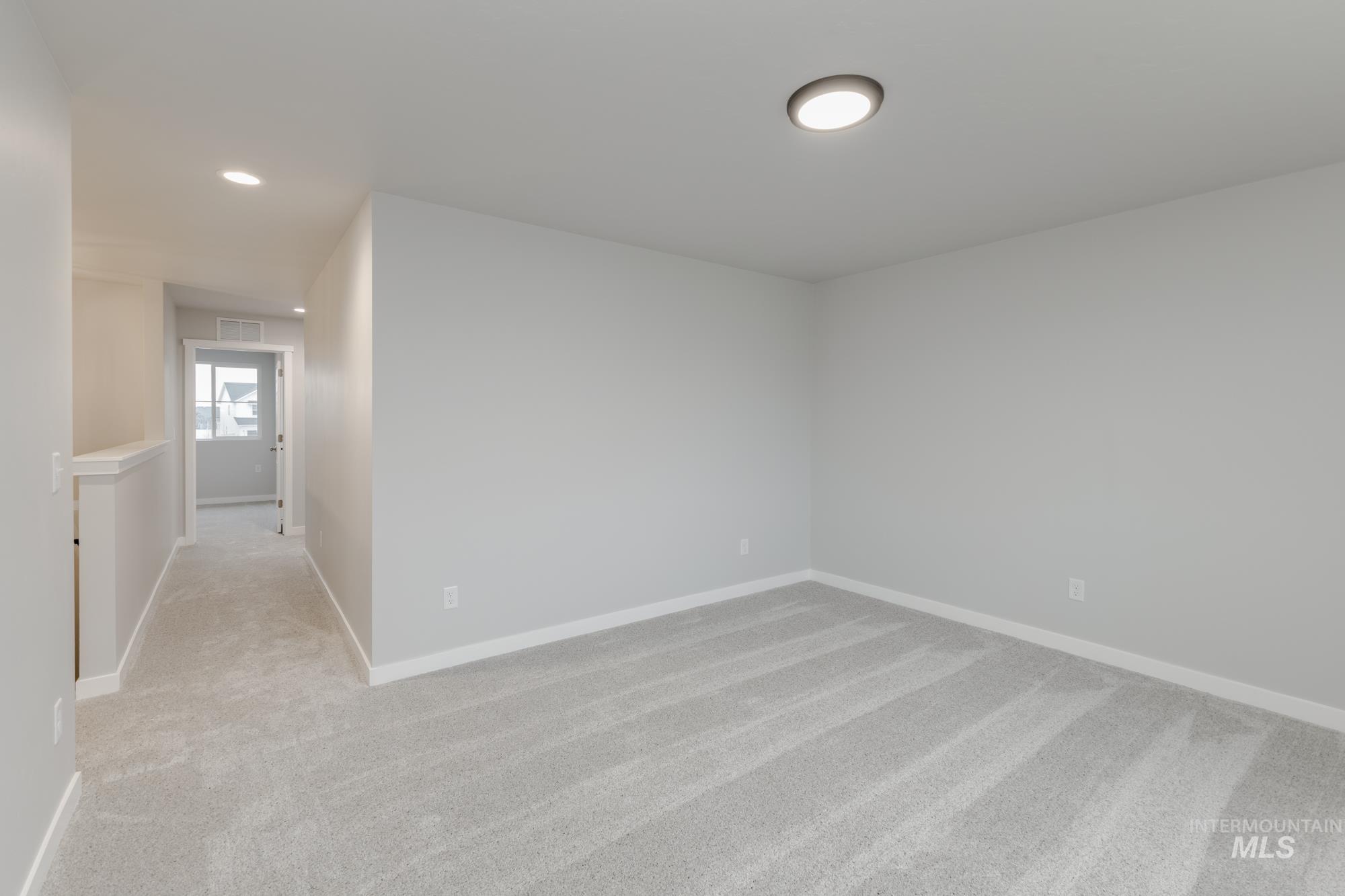 1591 Covington Street Middleton, ID 83644 - Photo 13 of 23 Spare room featuring light carpet and recessed lighting