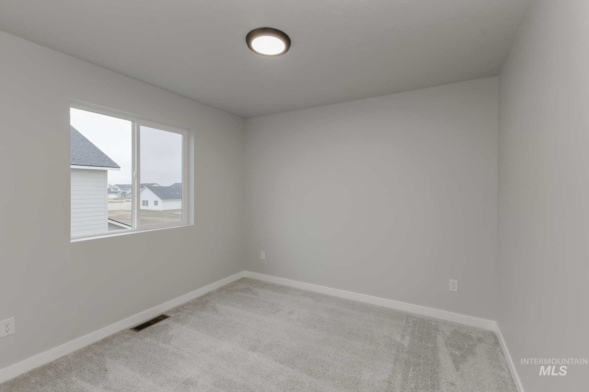 1591 Covington Street Middleton, ID 83644 - Photo 16 of 23 Unfurnished room with carpet floors and baseboards