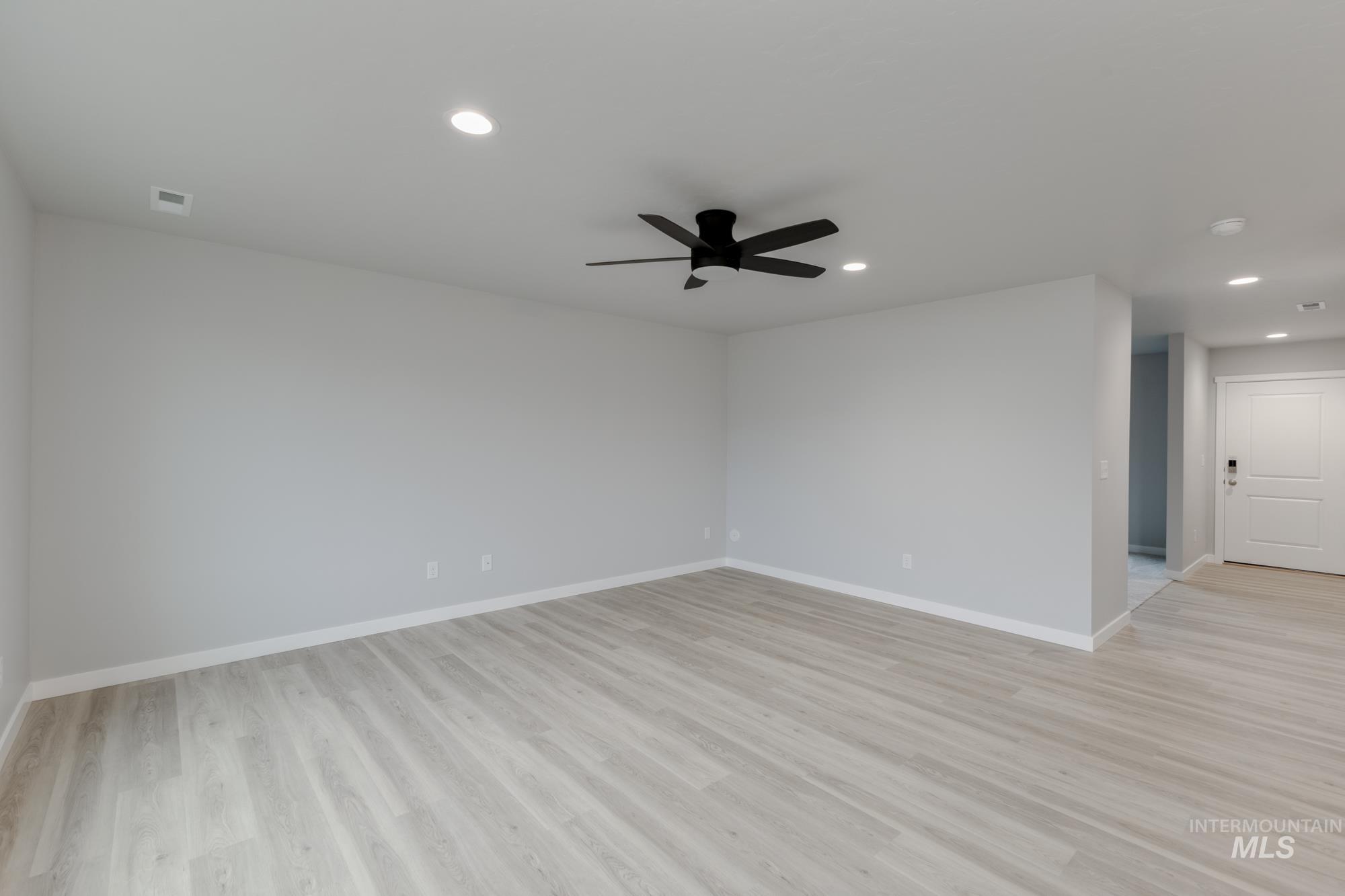 1591 Covington Street Middleton, ID 83644 - Photo 7 of 23 Spare room featuring recessed lighting, light wood-type flooring, and ceiling fan