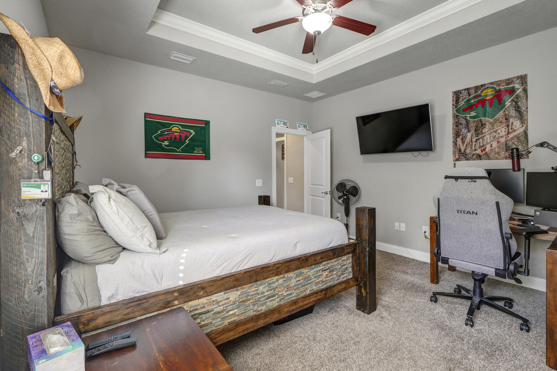 2136 Nina Street Navarre, FL 32566 - Photo 20 of 28 a bedroom with a bed a computer on a desk and chair