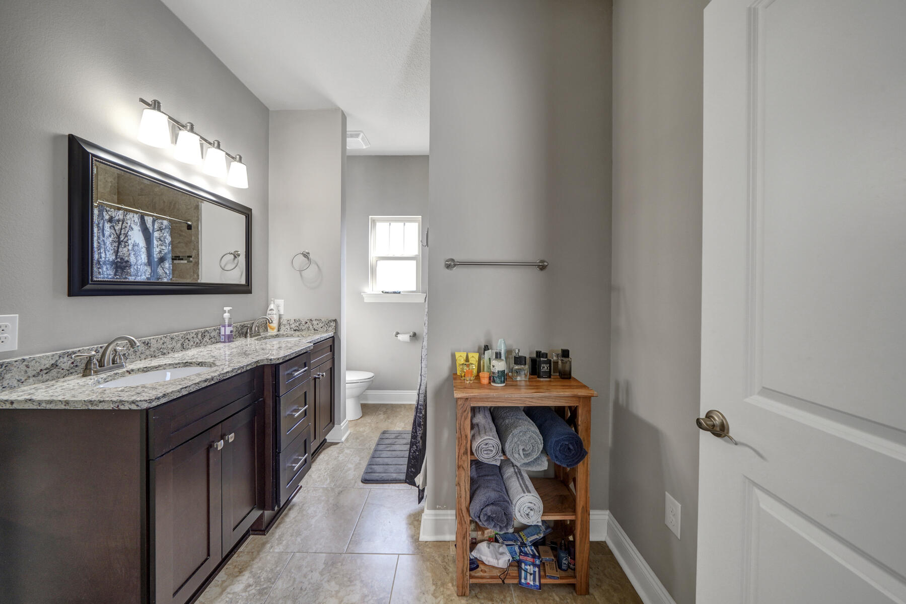 2136 Nina Street Navarre, FL 32566 - Photo 10 of 28 a view of a bathroom with sink and mirror