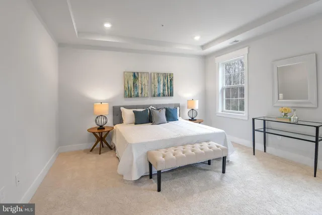 a bedroom with a bed and a table in it