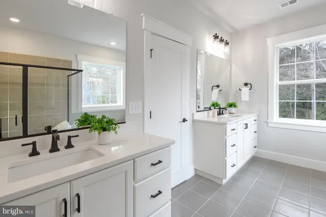 a bathroom with a bathtub and a sink