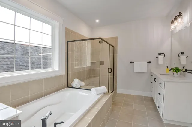 a bathroom with a shower and a bathtub