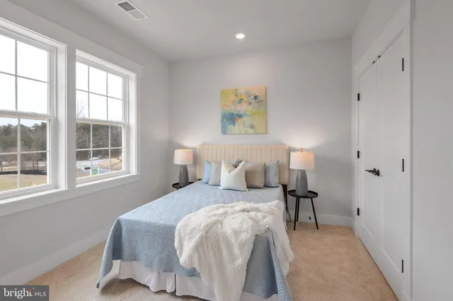 a bed room with a bed and a lamp