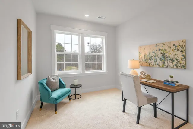 a view of a workspace with furniture