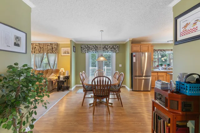a utility room with fridge dryer and washer